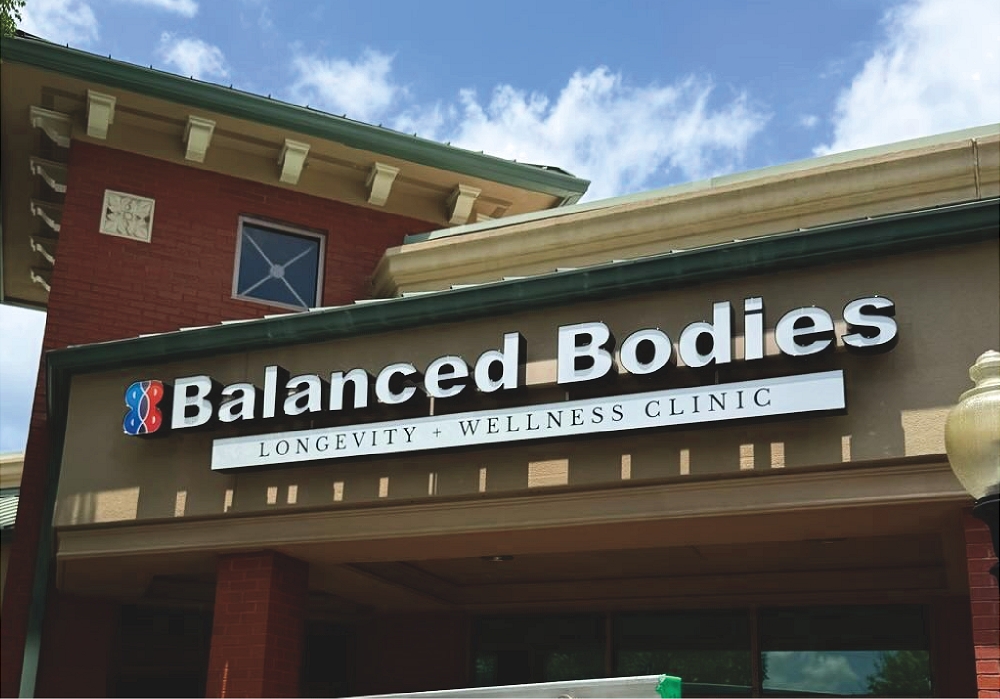 Blue cloudy sky above storefront window