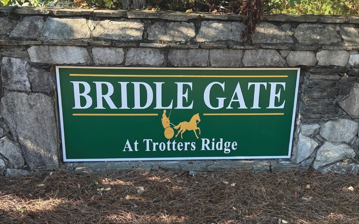 Plant sign at street bridge gate