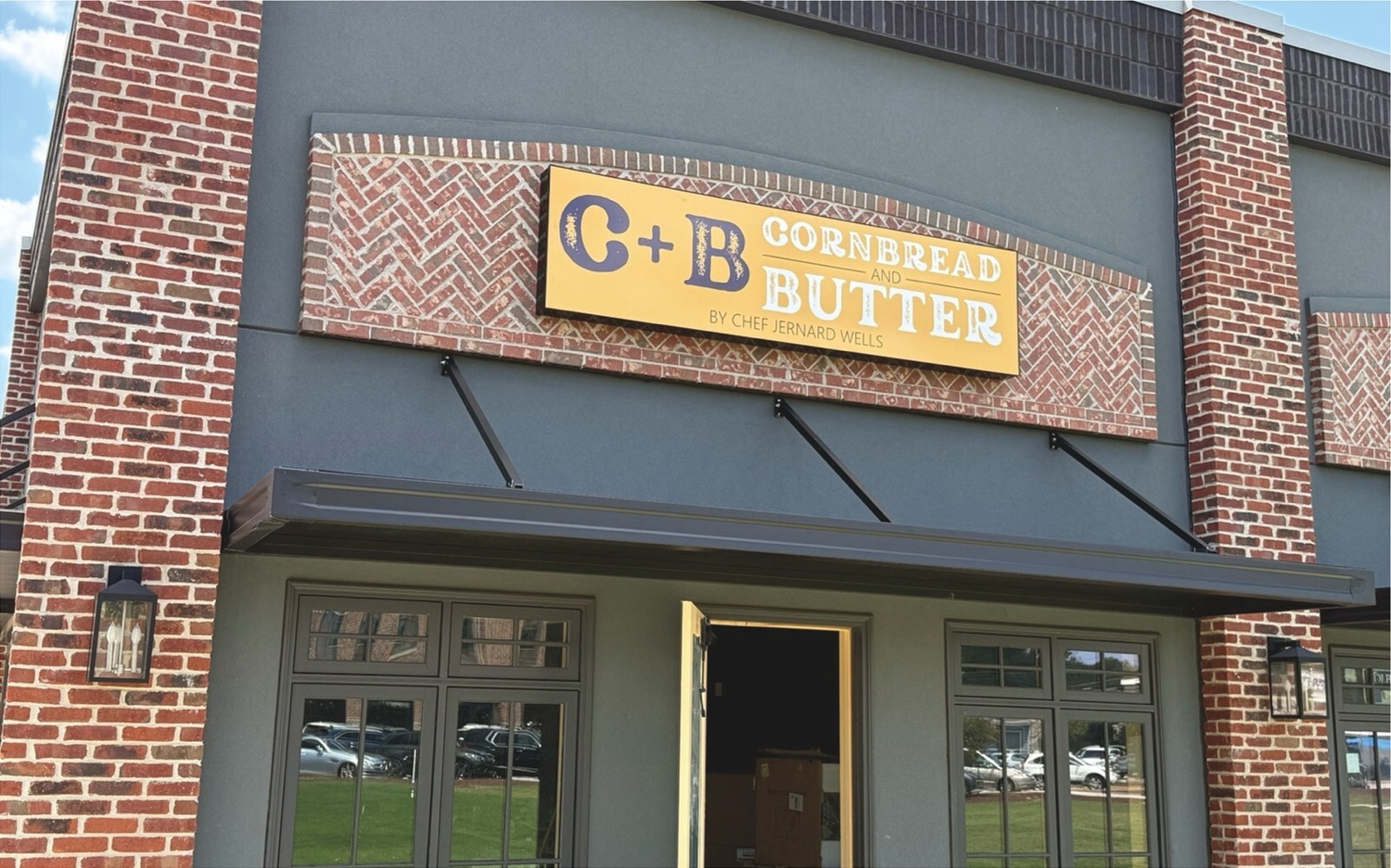 Brick door opens to blue sky portal