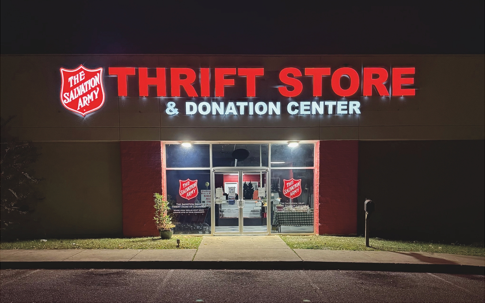 Portal through storefront to grassy outdoor land